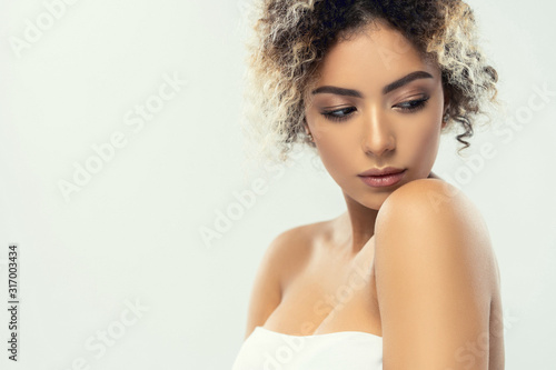 Beauty closeup portrait of beautiful mixed race caucasian - african american woman looking at camera