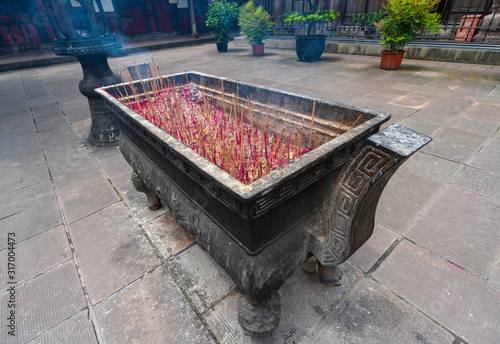 Receptacle for burning incense. Believers burn their offerings here before prayers. Wenshu Monastery, Chengdu city, China photo