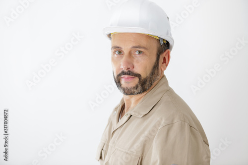 portrait of builder man standing indoors
