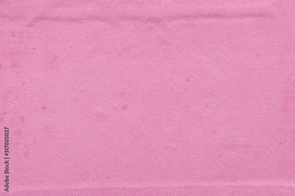 Fototapeta premium Cardboard pink abstract pattern texture close-up. Retro old paper background. Grunge concrete wall. Vintage blank wallpaper.