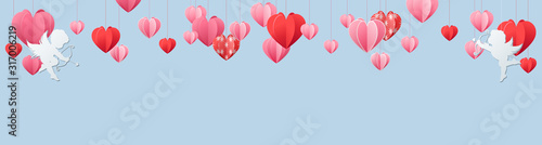 Valentines day panorama banner with border of red and pink hearts with white cherubs or Cupids over blue with copy space