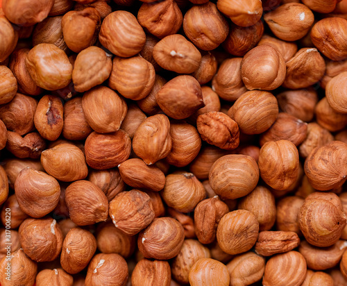 Background of peeled nuts. Hazelnuts, food, proper nutrition.