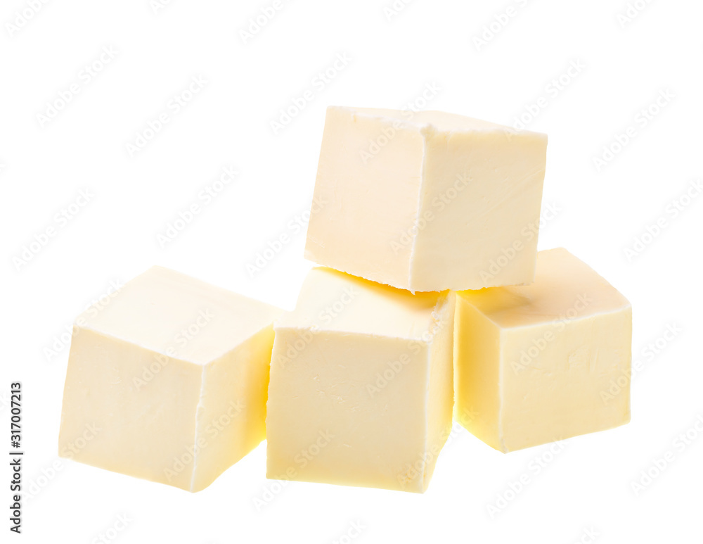 Pieces of butter isolated on white background.