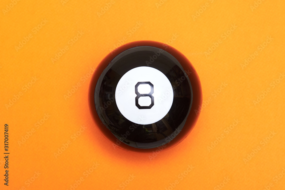 Magic ball of predictions figure eight on an orange background. Magic ball of predictions figure eight on an orange background.