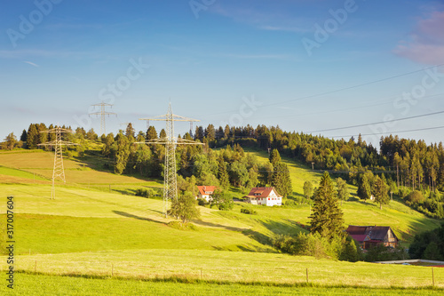 Beautiful view of a high-voltage power line in the Black Forest mountains. Germany.