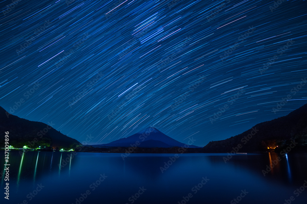 Star trails over Mount Fuji on a clear night from lake Shoji, Yamanashi