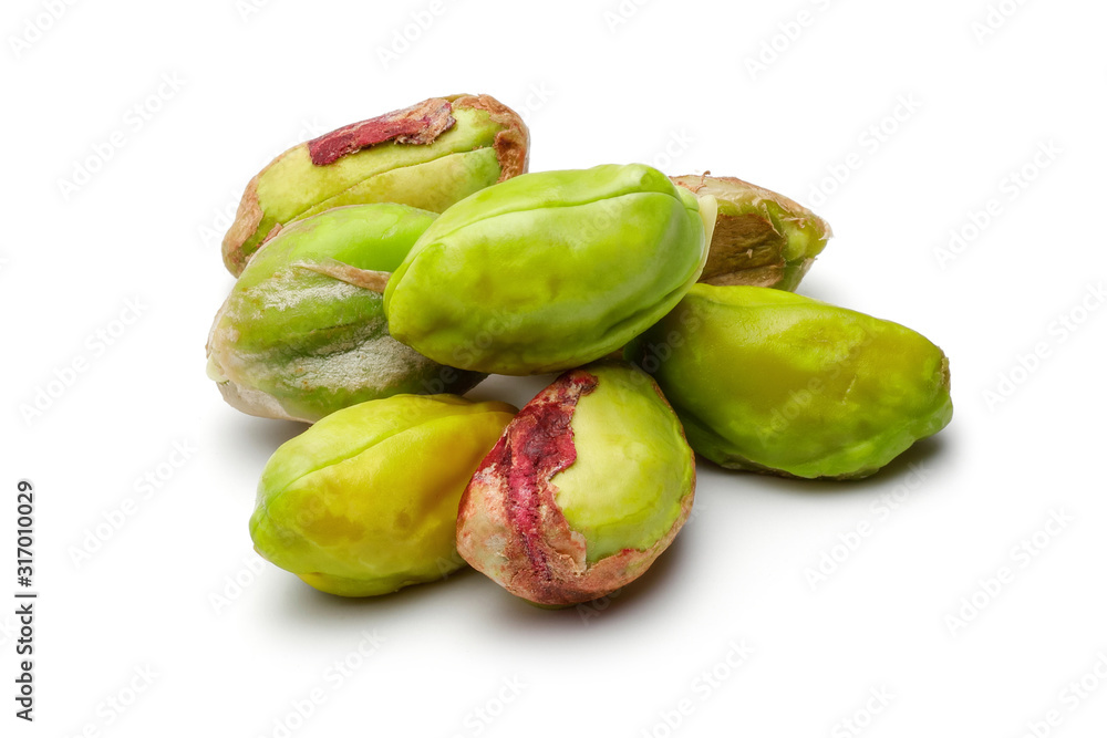 Heap of peeled pistachio nuts isolated Heap of peeled pistachio nuts isolated
