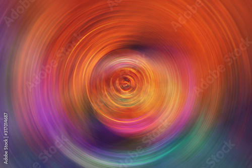 Colorful blurred gradient radial motion background. Red, orange, green, purple, blue mixed multicolor texture