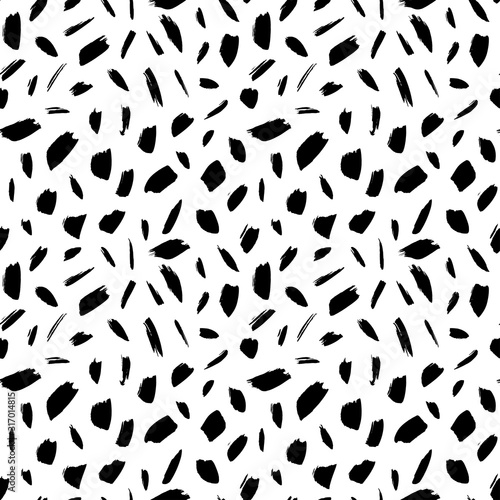 Scattered abstract black ink spots vector seamless pattern. Small chaotic grunge scribbles decorative background.