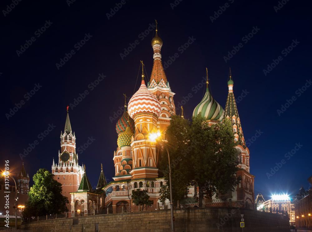 Spasskaya tower of Moscow Kremlin and Saint Basil's Cathedral in Moscow. Russia