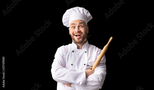 Excited Baker Holding Rolling Pin Posing Over Black Background, Panorama