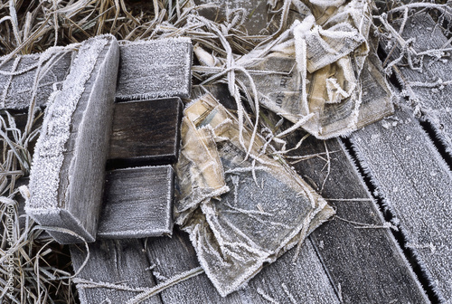 Frozen ojects on boardwalk in winter photo