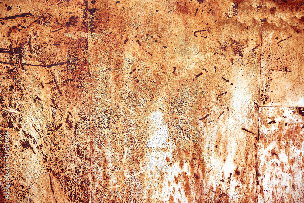 Fototapeta premium Rusty metal surface with peeled paint and etched numbers. Abstract background texture.