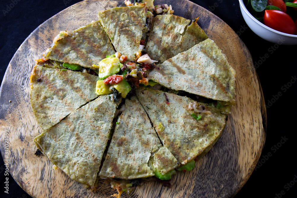 Chicken Quesadilla with avocado, dried tomatoes and jalapeno