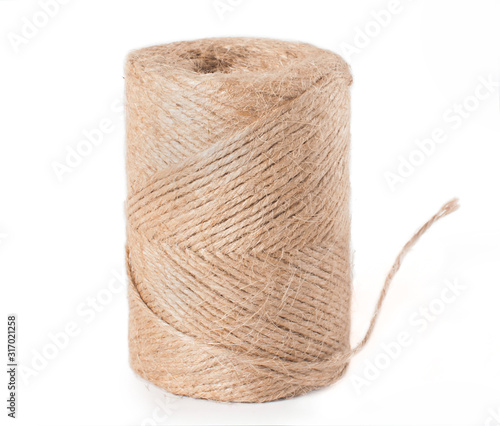 Ball of jute twine closeup on a white background isolated