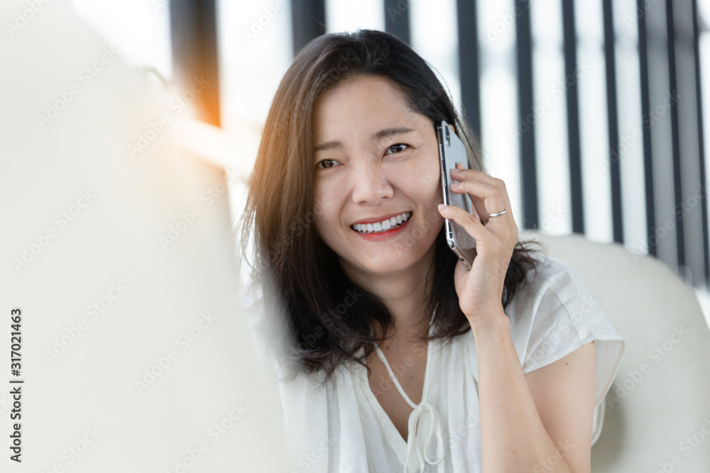 using cell phone.hand holding texting message on screen mobile chatting friend ,search internet information sitting on sofa in office.technology device contact communication connecting people concept using cell phone.hand holding texting message on screen mobile chatting friend ,search internet information sitting on sofa in office.technology device contact communication connecting people concept