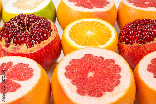 Grapefruit, orange, pomegranate, citrus sweetie on white background.