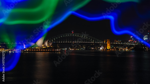 A beautiful view of Sydney harbor at night with City light illumination and reflection of lights.