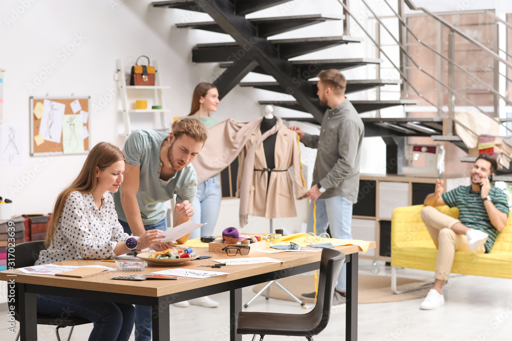 Fototapeta premium Fashion designers creating new clothes in studio