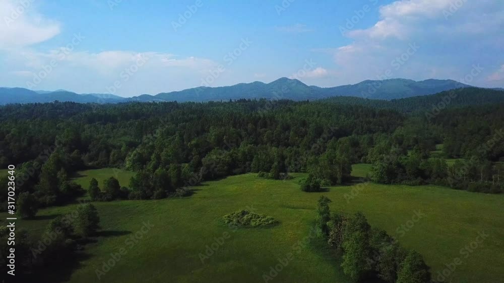 Aerial shot of a mountian and forest landscape Aerial shot of a mountian and forest landscape