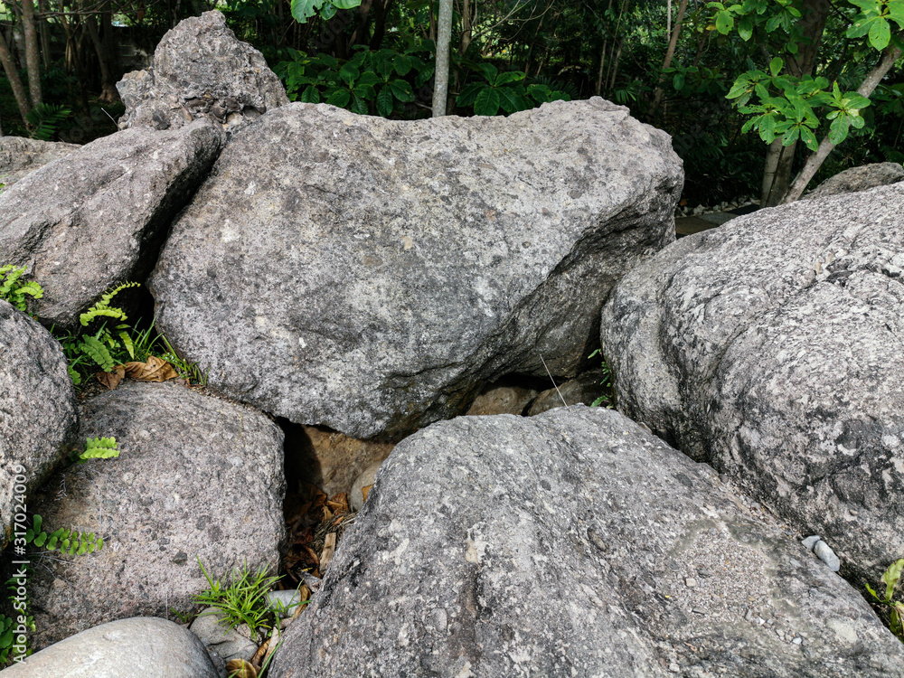 Texture of Big Stones laying on ground in the park Texture of Big Stones laying on ground in the park