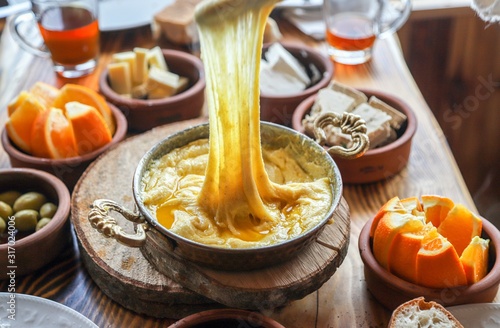 Mihlama (kuymak) is a famous traditional food from Black Sea region in Turkey. It is prepared with corn meal and cheese and served hot.