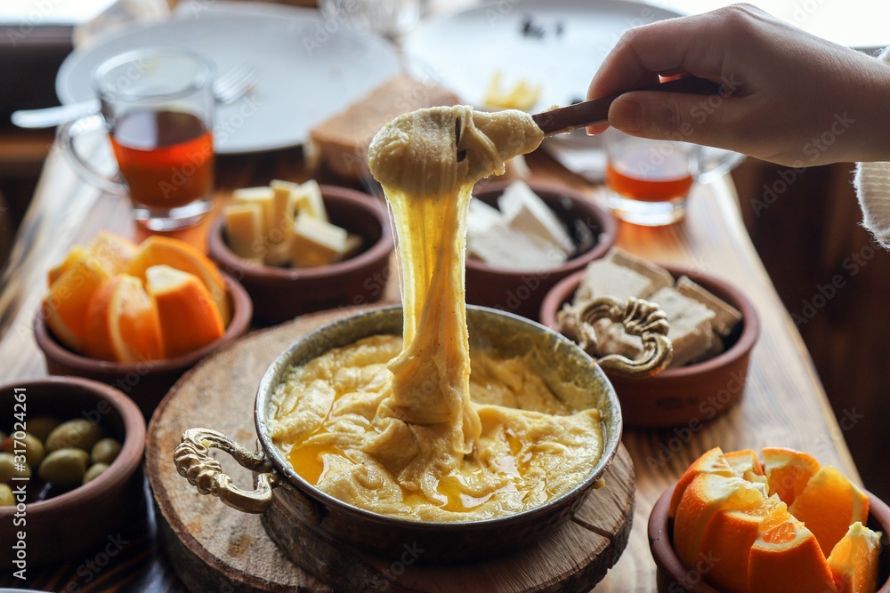 Mihlama (kuymak) is a famous traditional food from Black Sea region in Turkey. It is prepared with corn meal and cheese and served hot.