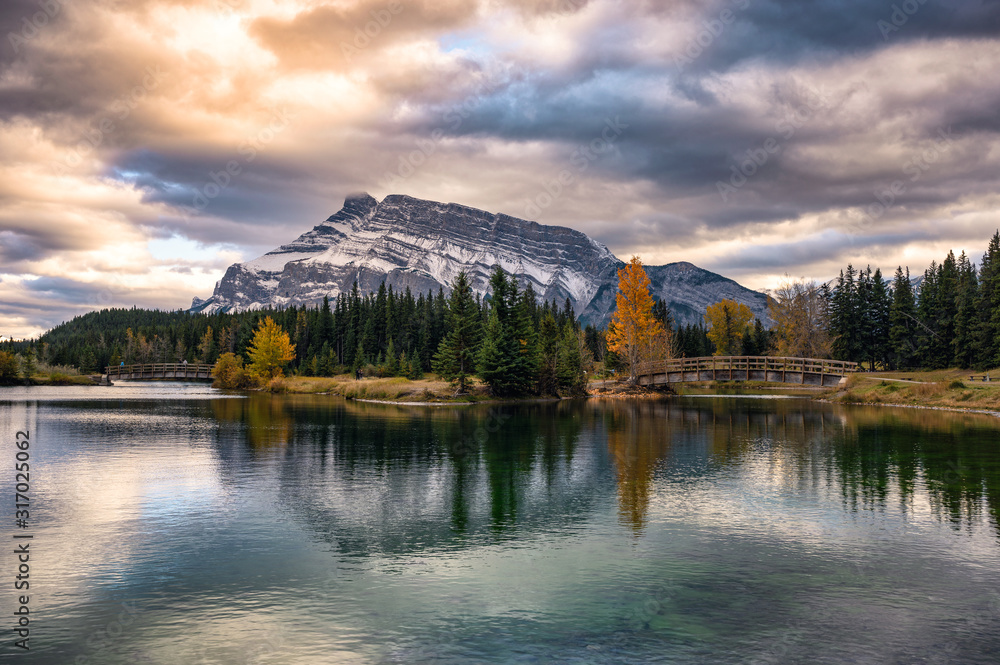 Cascade ponds with mount rundle and wooden bridge in autumn forest at Banff national park Cascade ponds with mount rundle and wooden bridge in autumn forest at Banff national park