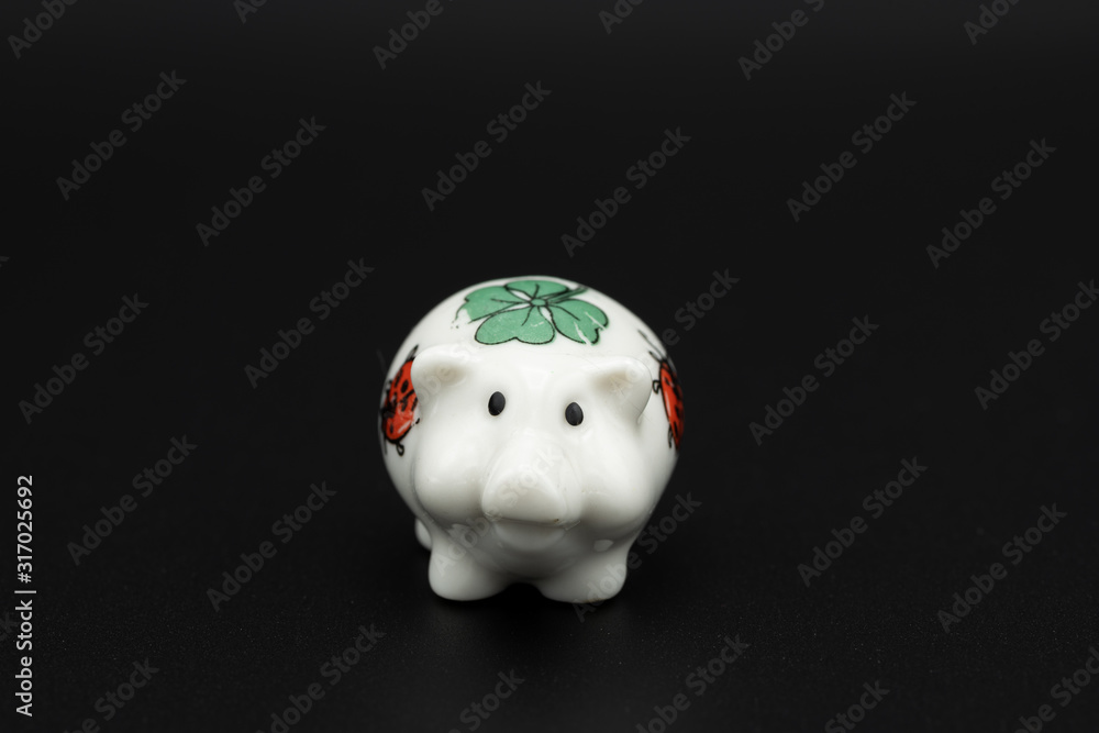 Figurine of a small white porcelain piggy Figurine of a small white porcelain piggy