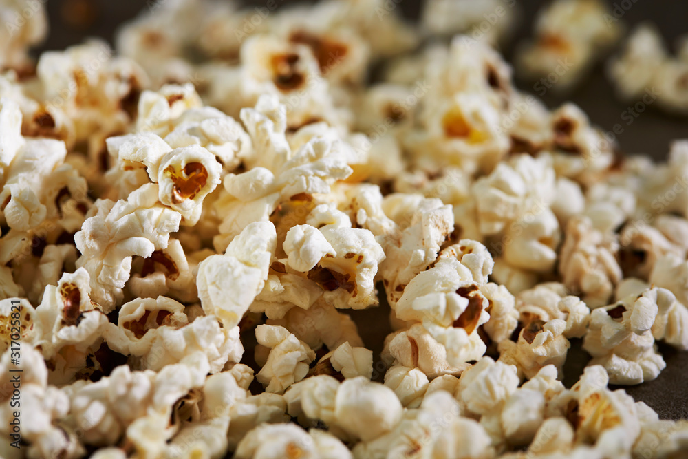 Popcorn on black background, close up Popcorn on black background, close up