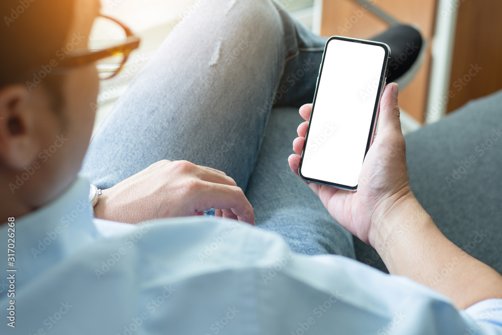 Mockup image blank white screen cell phone.woman hand holding texting using mobile on desk at coffee shop.background empty space for advertise text.people contact marketing business,technology Mockup image blank white screen cell phone.woman hand holding texting using mobile on desk at coffee shop.background empty space for advertise text.people contact marketing business,technology