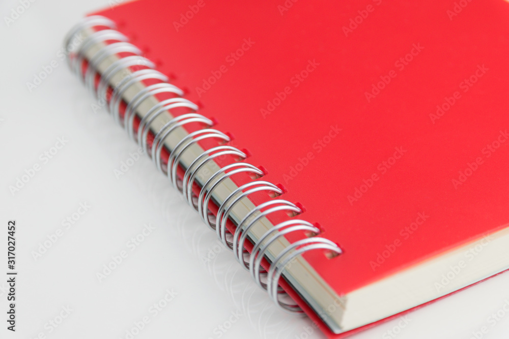 Red notebook isolated on white background. Red notebook isolated on white background.