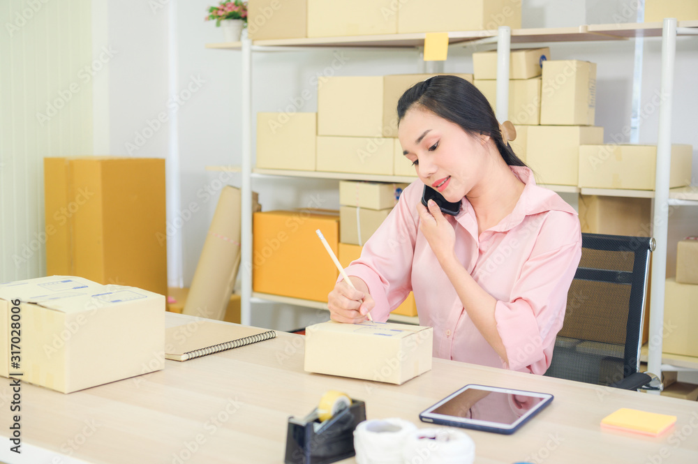 Start up small business entrepreneur SME or freelance woman working at home concept, Young Asian small business owner at home office, online marketing packaging and delivery, SME concept top view