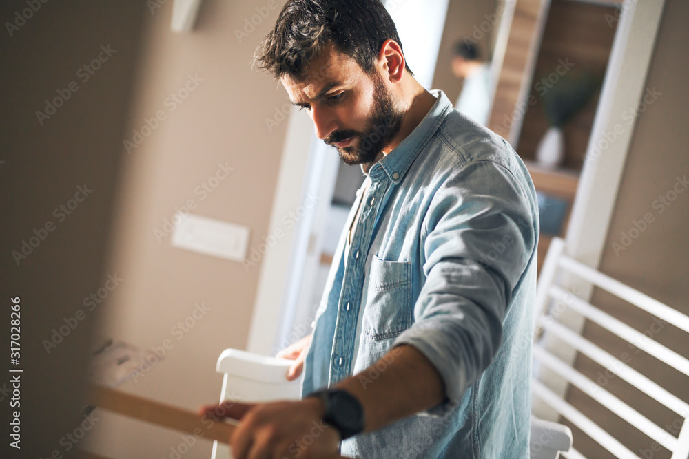 Man trying to assemble baby crib. Man trying to assemble baby crib.