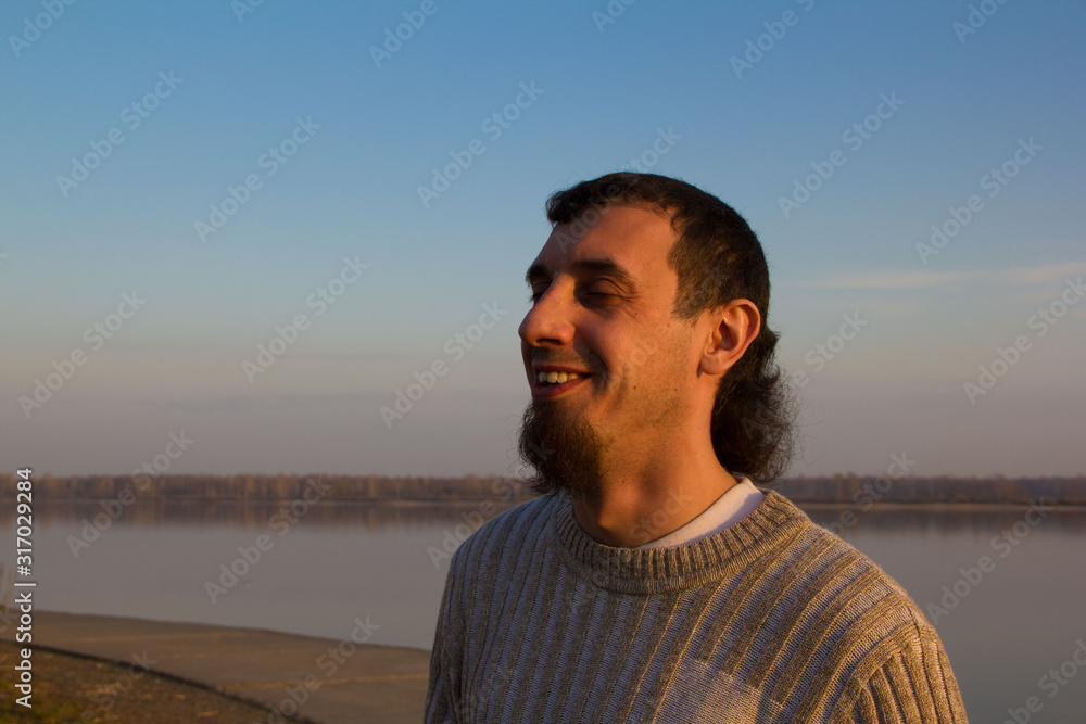 smiling man on the river Bank