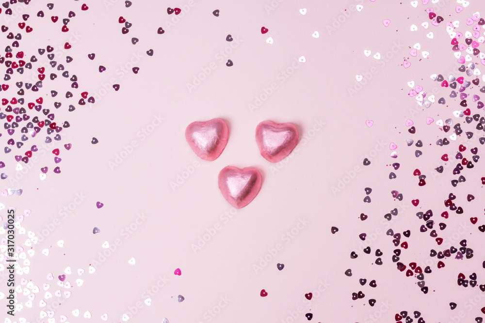 Conffeti hearts on a pink pastel trendy background Valentine's day festive background