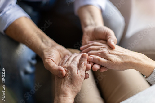 Fototapeta Naklejka Na Ścianę i Meble -  Close up of senior couple holding hands