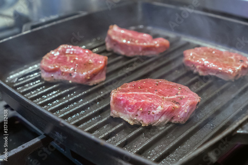 Raw fresh meat steak on grill pan