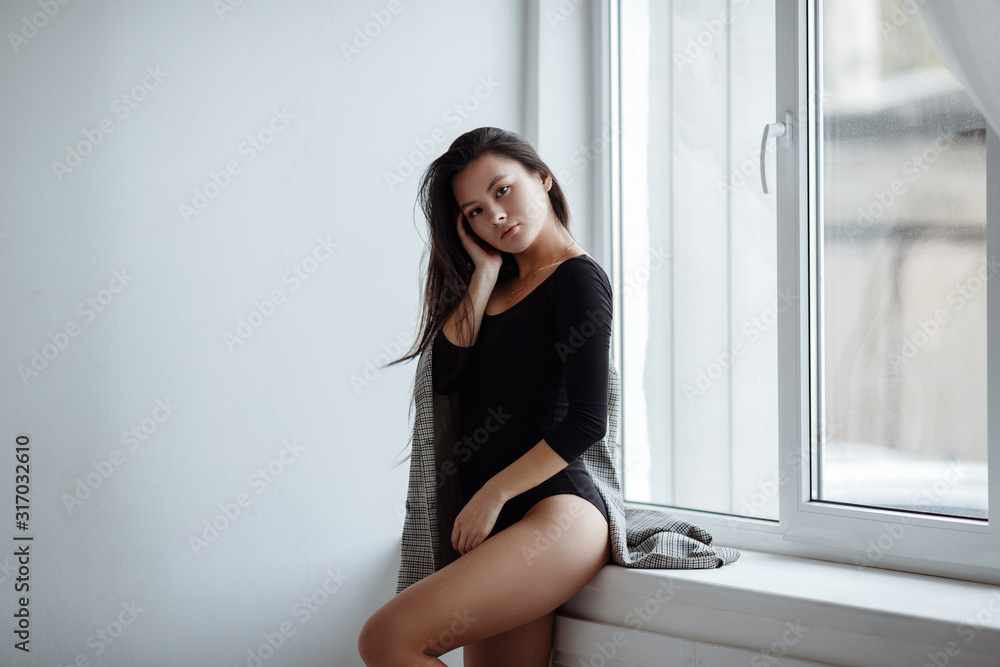 portrait of mixed race Asian Caucasian female in studio. portrait of mixed race Asian Caucasian female in studio.
