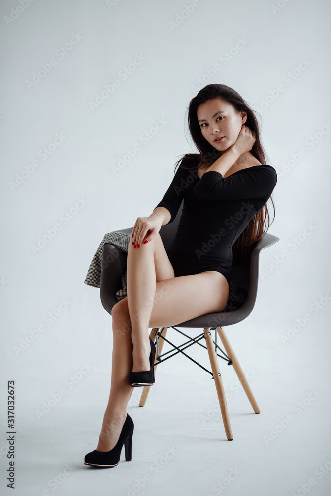 portrait of mixed race Asian Caucasian female in studio. portrait of mixed race Asian Caucasian female in studio.