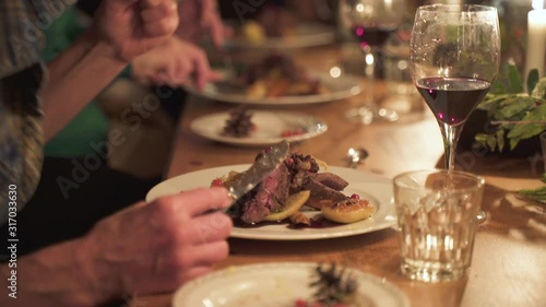 Gourmet Fine Dining Cuisine Woman Eats Steak at Dinner Table