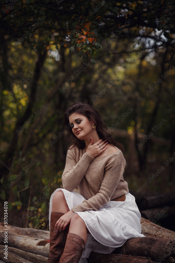Girl resting in the village, portrait of a woman in rustic style. Girl resting in the village, portrait of a woman in rustic style.
