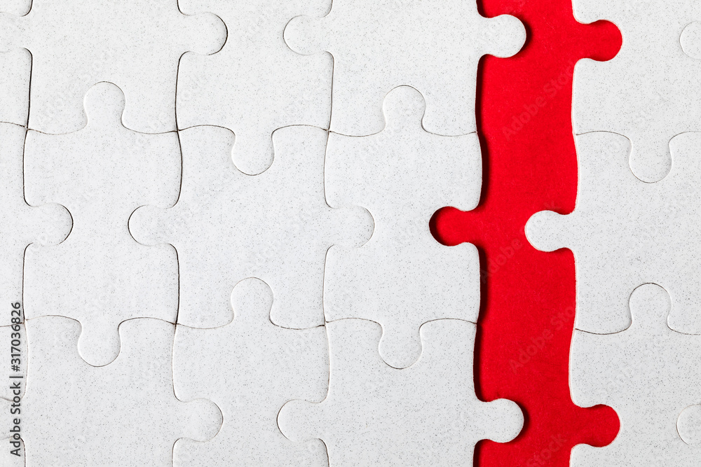 White jigsaw puzzle pieces. Fill in pieces of the jigsaw puzzle. Complete the jigsaw puzzle with the missing pieces. Fragment of a folded white jigsaw puzzle. White jigsaw puzzle pieces. Fill in pieces of the jigsaw puzzle. Complete the jigsaw puzzle with the missing pieces. Fragment of a folded white jigsaw puzzle.