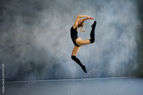 Blond woman jumping in dance class