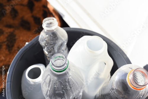 Plastic recycling, plastic bottles and containers from household waste to recycle and re use photo