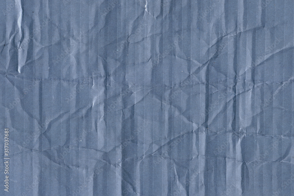 Fototapeta premium Blue vintage rough sheet of carton. Recycled environmentally friendly cardboard paper texture. Simple minimalist papercraft background.