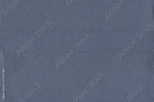 Blue vintage rough sheet of carton. Recycled environmentally friendly cardboard paper texture. Simple minimalist papercraft background.