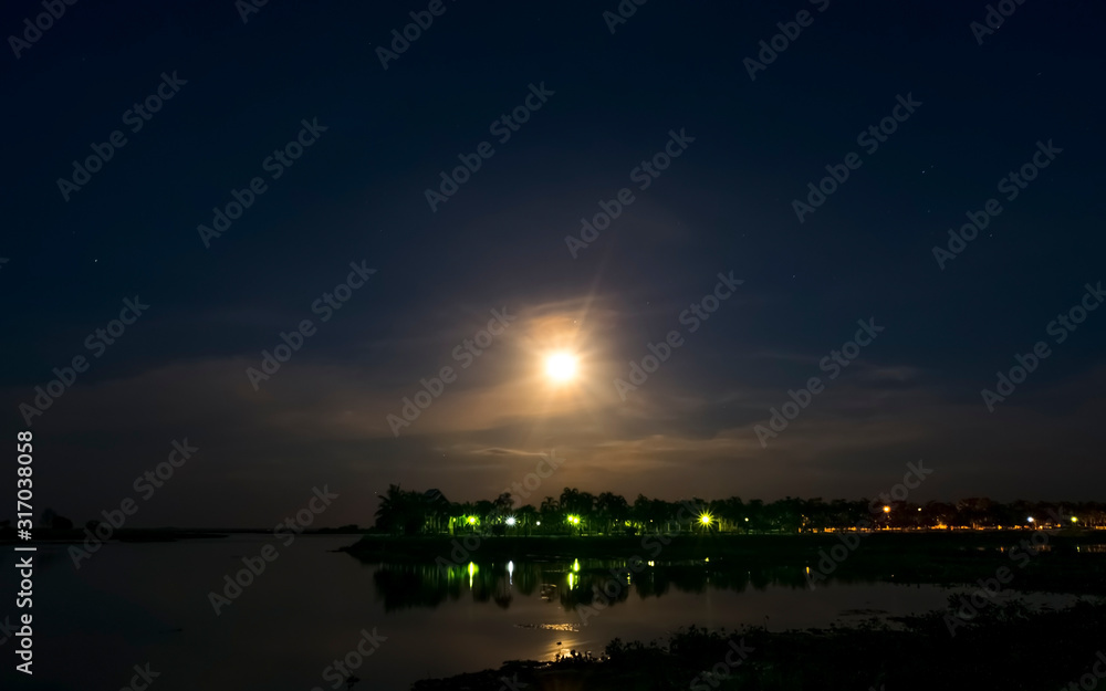 Moon light over the lake with night sky Moon light over the lake with night sky