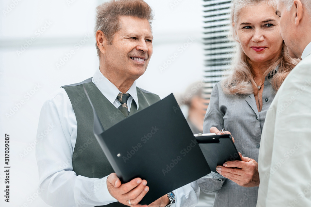 close up. businesswoman discussing work plan with her colleagues close up. businesswoman discussing work plan with her colleagues