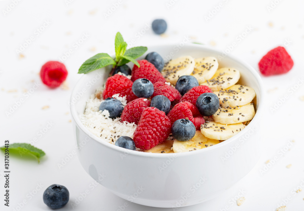 Healthy breakfast with granola, yogurt, berries and bananas. Tasty summer breakfast. Healthy breakfast with granola, yogurt, berries and bananas. Tasty summer breakfast.